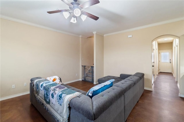 living room featuring ceiling fan and ornamental molding