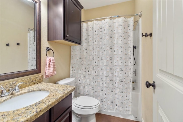 full bathroom featuring toilet, shower / tub combo, and vanity