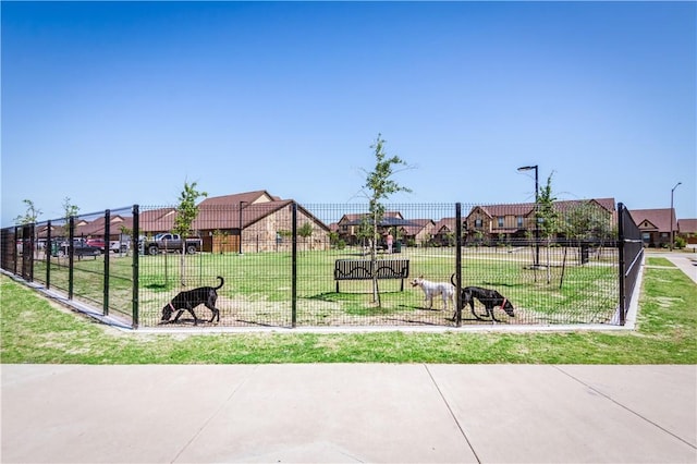 view of home's community featuring a lawn