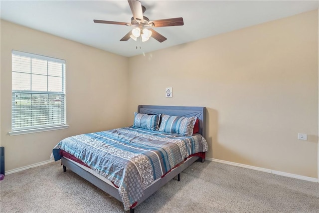 bedroom with ceiling fan and light carpet