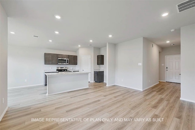 unfurnished living room with light wood-type flooring