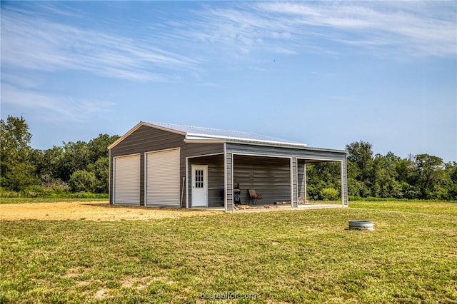 view of outbuilding featuring a yard and a garage