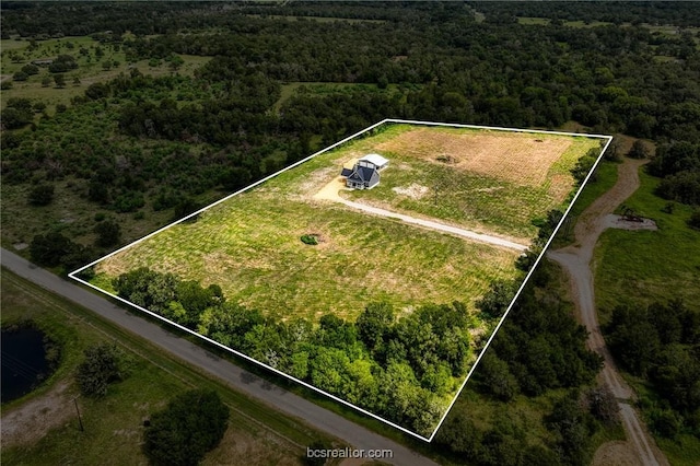 birds eye view of property featuring a rural view