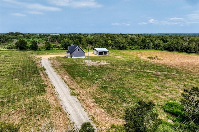 birds eye view of property with a rural view