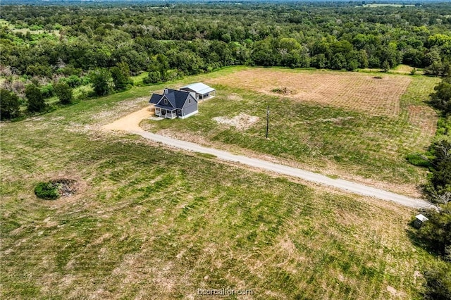 birds eye view of property with a rural view