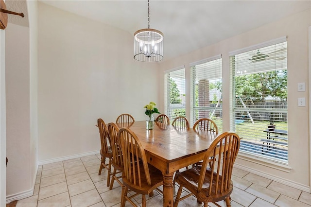 3307 Fredrick Ct, College Station, TX 77845 - dining space featuring a chandelier, light tile patterned floors, and baseboards