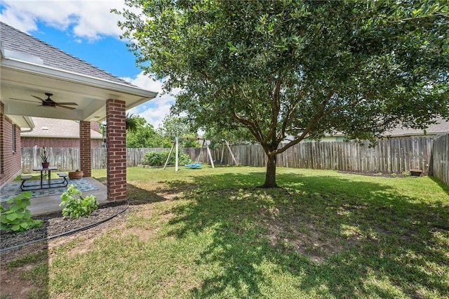 3307 Fredrick Ct, College Station, TX 77845 - view of yard with a ceiling fan, a playground, and a patio area