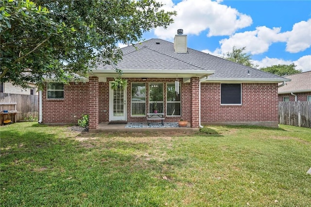 3307 Fredrick Ct, College Station, TX 77845 - rear view of property with a chimney, brick siding, a patio, and a shingled roof