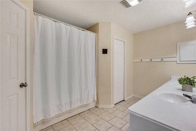 3307 Fredrick Ct, College Station, TX 77845 - full bath with tile patterned flooring, double vanity, and baseboards