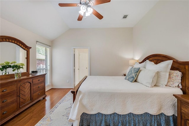 3307 Fredrick Ct, College Station, TX 77845 - bedroom featuring wood finished floors, lofted ceiling, ceiling fan, and baseboards