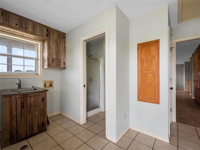 17645 Hwy 6, Navasota, TX 77868 - kitchen featuring a sink and light tile patterned floors
