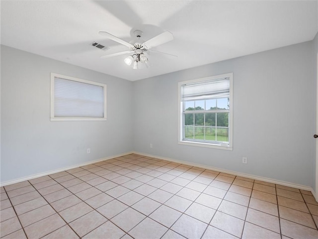 17645 Hwy 6, Navasota, TX 77868 - empty room with ceiling fan and light tile patterned flooring