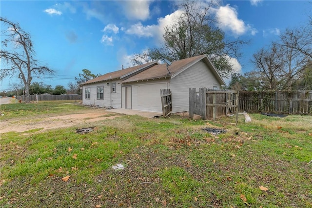 rear view of house with a lawn