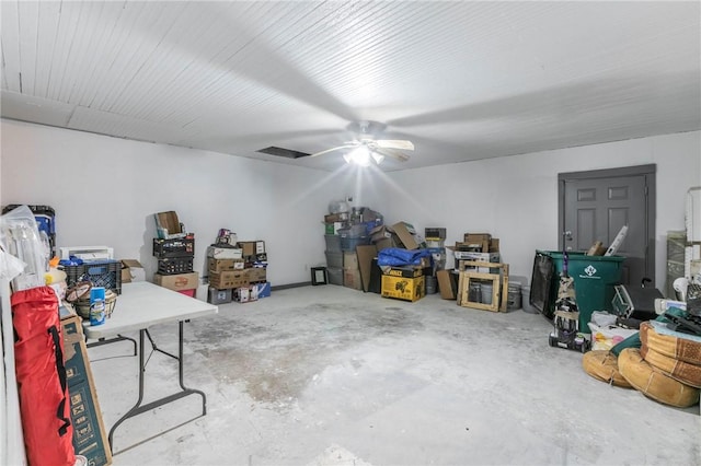 interior space featuring ceiling fan and concrete floors