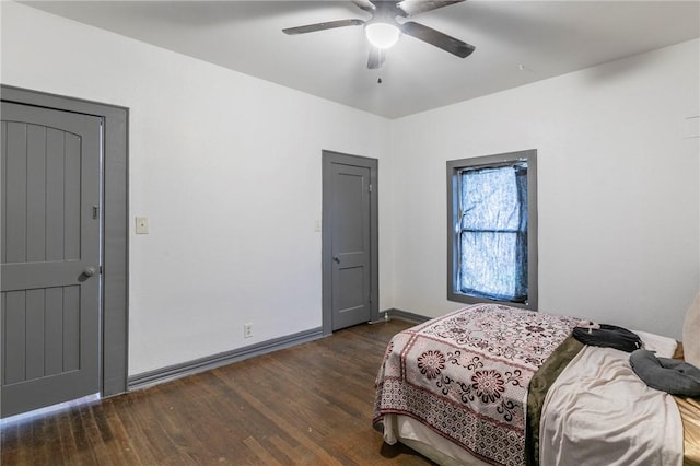 bedroom featuring dark wood-type flooring and ceiling fan