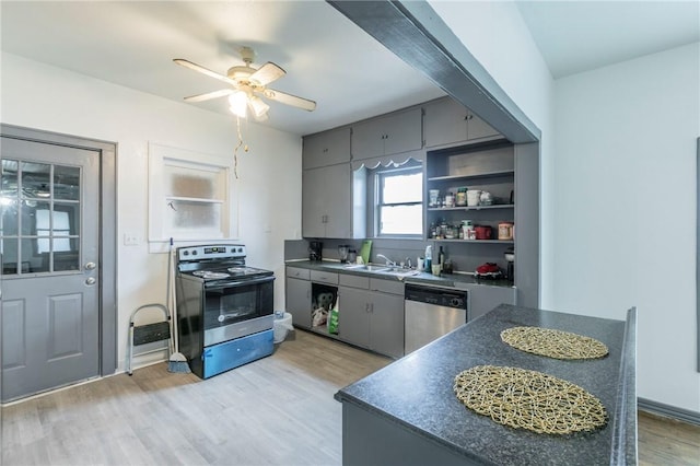 kitchen with ceiling fan, sink, light hardwood / wood-style flooring, and stainless steel appliances