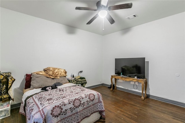 bedroom featuring ceiling fan and dark hardwood / wood-style flooring