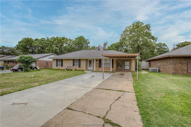 single story home featuring a front yard and central air condition unit