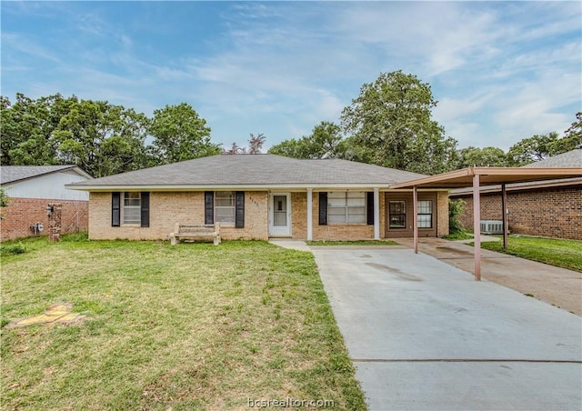 ranch-style home with a carport and a front yard