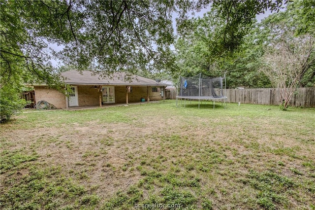 view of yard with a trampoline