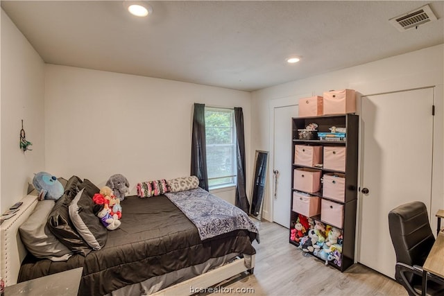 bedroom featuring light hardwood / wood-style floors