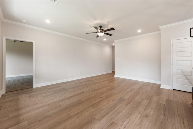 empty room featuring crown molding, light hardwood / wood-style flooring, and ceiling fan