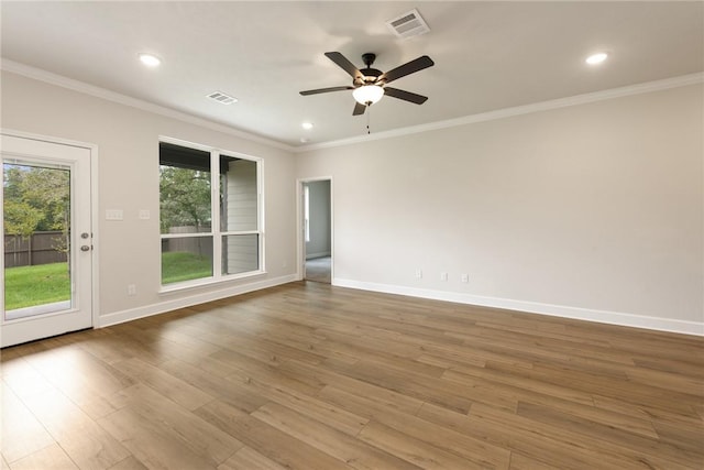 spare room with ceiling fan, wood-type flooring, and ornamental molding