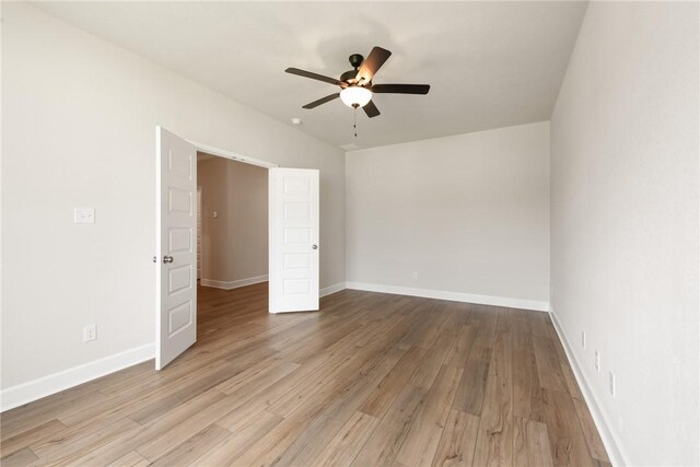 unfurnished bedroom featuring ceiling fan and light wood-type flooring