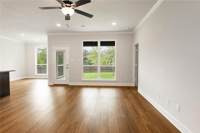 spare room with ceiling fan, ornamental molding, and hardwood / wood-style flooring