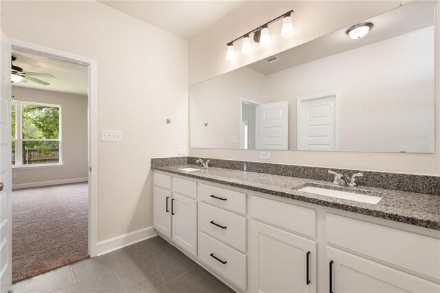 bathroom featuring tile patterned flooring, vanity, and ceiling fan