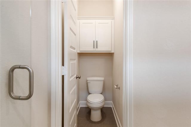 bathroom featuring toilet and tile patterned floors