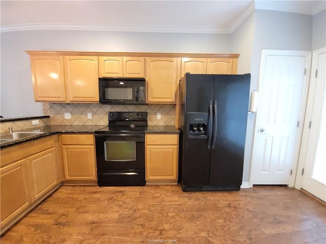 kitchen with sink, ornamental molding, black appliances, light brown cabinetry, and dark stone counters