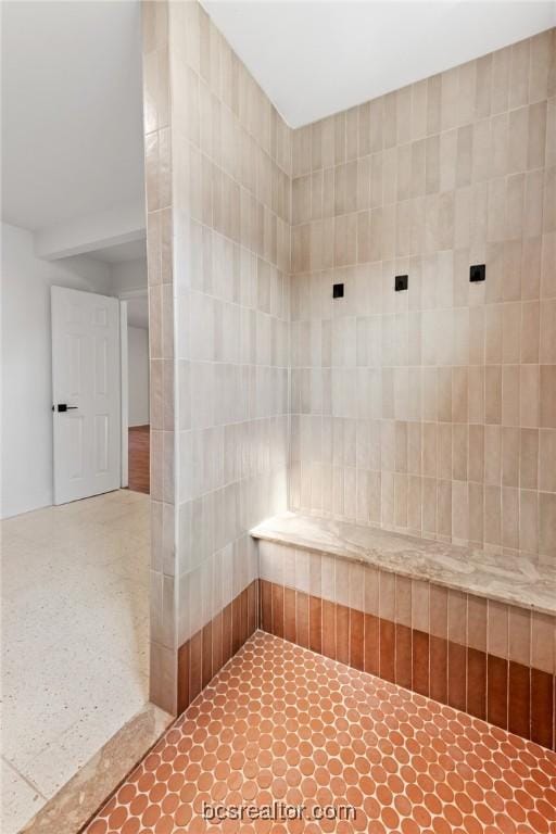 bathroom with tile walls