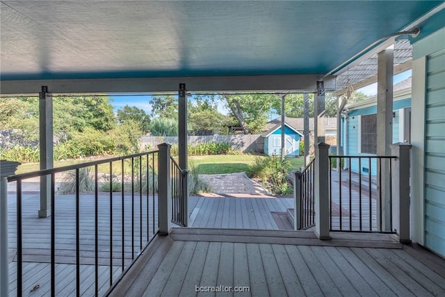 deck with a storage shed