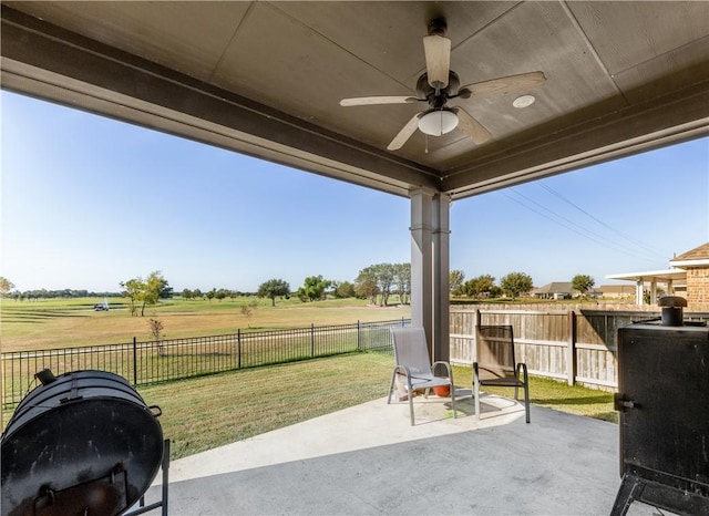 view of patio / terrace with a rural view and ceiling fan