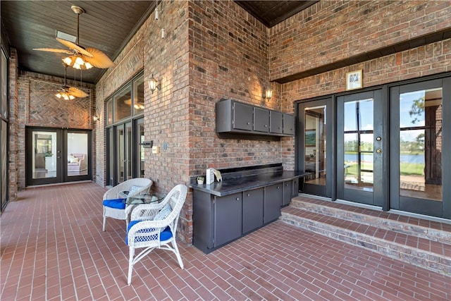 view of patio with a ceiling fan and french doors