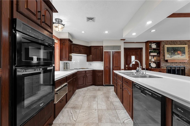 kitchen with recessed lighting, a sink, dishwashing machine, dobule oven black, and light countertops
