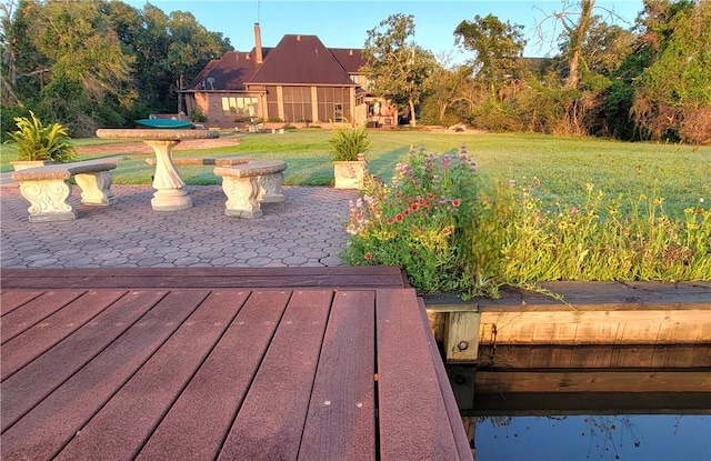 wooden deck featuring a yard