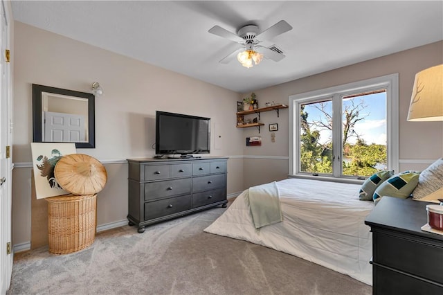 carpeted bedroom with baseboards and ceiling fan