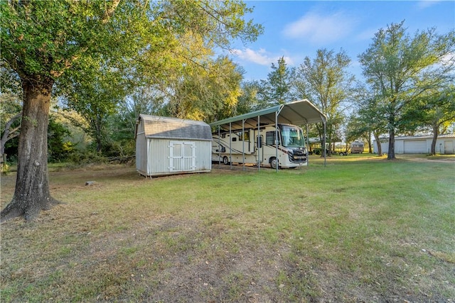 view of yard featuring a carport and a shed