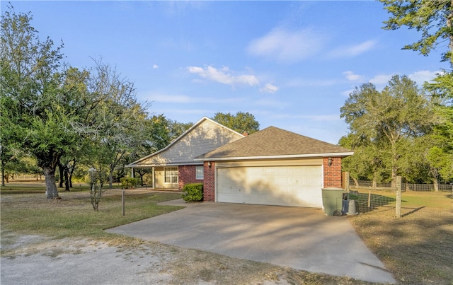 view of front facade with a garage and a front yard