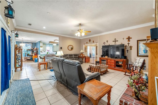 tiled living room featuring ceiling fan with notable chandelier, ornamental molding, and a textured ceiling