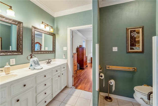 bathroom featuring tile patterned floors, vanity, toilet, and ornamental molding