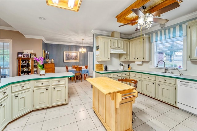 kitchen featuring dishwasher, a center island, a healthy amount of sunlight, and sink