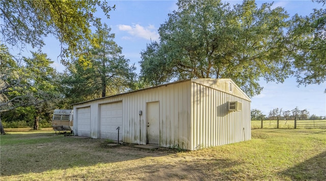 view of outbuilding featuring a yard and a garage