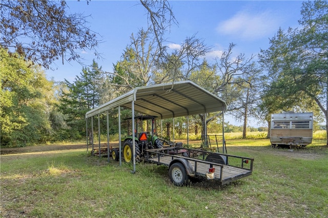 view of parking / parking lot featuring a carport and a lawn