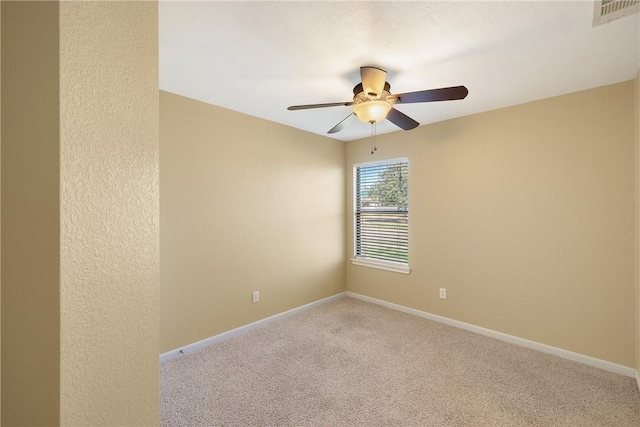 carpeted empty room with ceiling fan