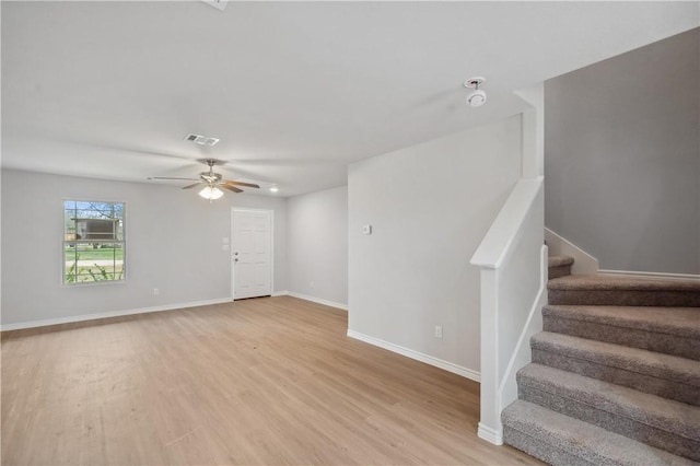 interior space with light wood-type flooring and ceiling fan