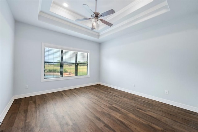 5398 Prairie Dawn Trl, College Station, TX 77845 - empty room with ceiling fan, a raised ceiling, baseboards, ornamental molding, and dark wood-type flooring