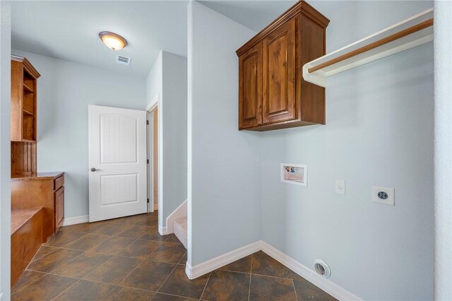 5398 Prairie Dawn Trl, College Station, TX 77845 - laundry area with baseboards, hookup for an electric dryer, hookup for a washing machine, and visible vents